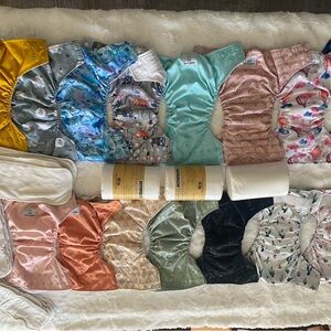 17 pocket cloth diapers + inserts, liners, and storage bags